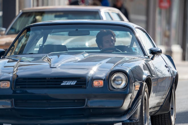 Jeremy Allen White drives a Z28 Camaro during the filming of a scene for the Bruce Springsteen movie Deliver Me from Nowhere in Freehold, NJ Friday, January 10, 2025. Both Jeremy Allen White and Bruce Springsteen were on set.