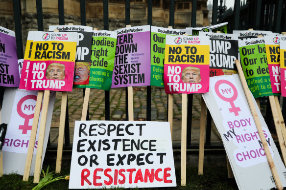 Placards at the rally, which organisers say is part of a longer-term resistance strategy to oppose the policies of the new Trump administration.