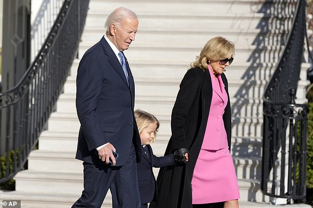 The First Lady, 73, wore a striking outfit, consisting of a Barbie-pink pencil skirt sitting just above the knees and a matching blazer with three large buttons