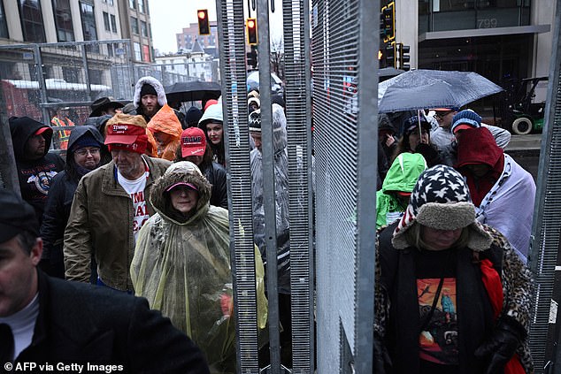 Supporters of US President-elect Donald Trump wait outside for a MAGA victory rally