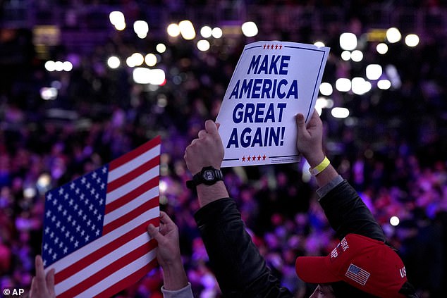 Rally attendees held up signs which sported Trump's longstanding slogan and promise to voters: that he will Make America Great Again