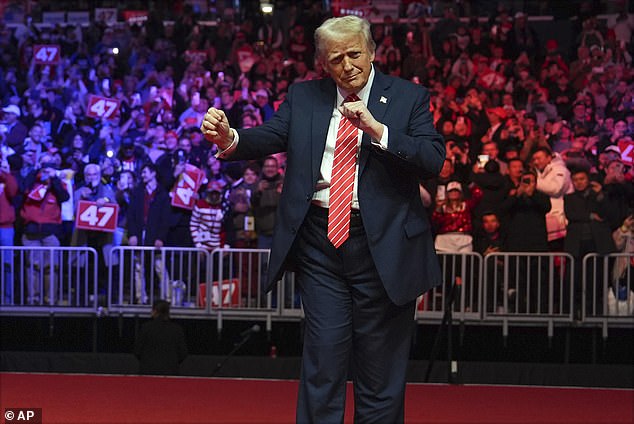 Donald Trump performs a little jig as the Village People close out his celebratory rally with YMCA