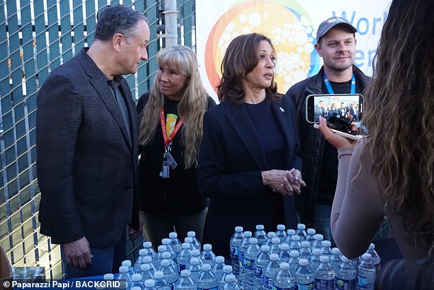 Harris - who promised Friday that she will not 'go quietly into the night' - and Emhoff then served firefighters meals at a World Central Kitchen stop in Altadena, where much of the damage has been done