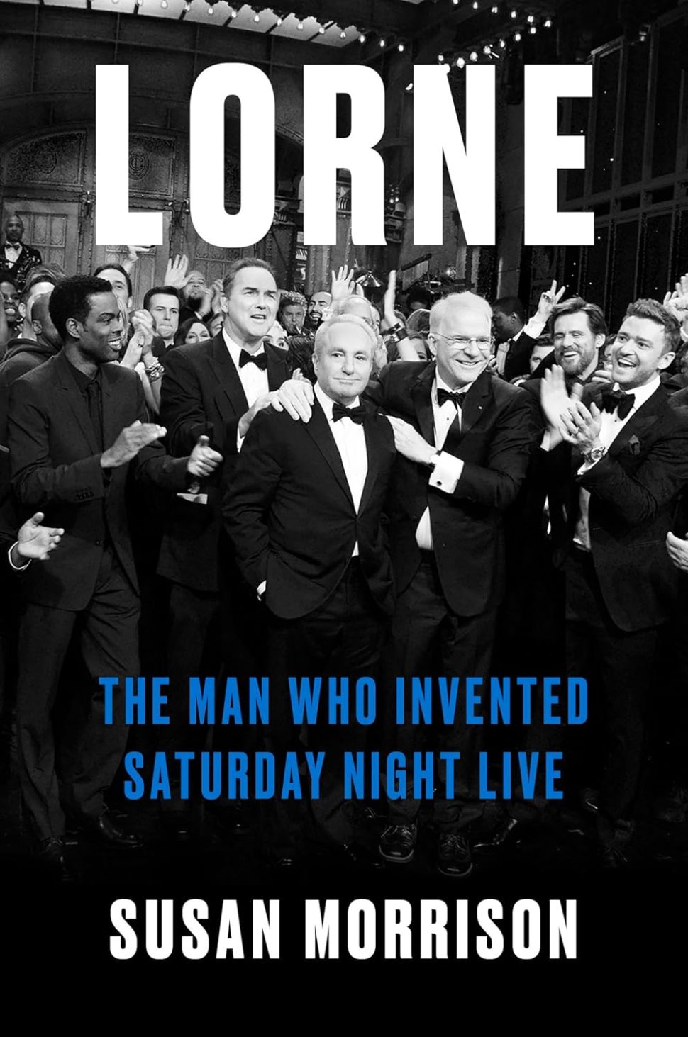 An image of the book cover for Lorne by Susan Morrison, displaying a black-and-white photograph of Lorne Michaels surrounded by past and present cast members of Saturday Night Live, all in tuxedos, with the title in bold white letters.