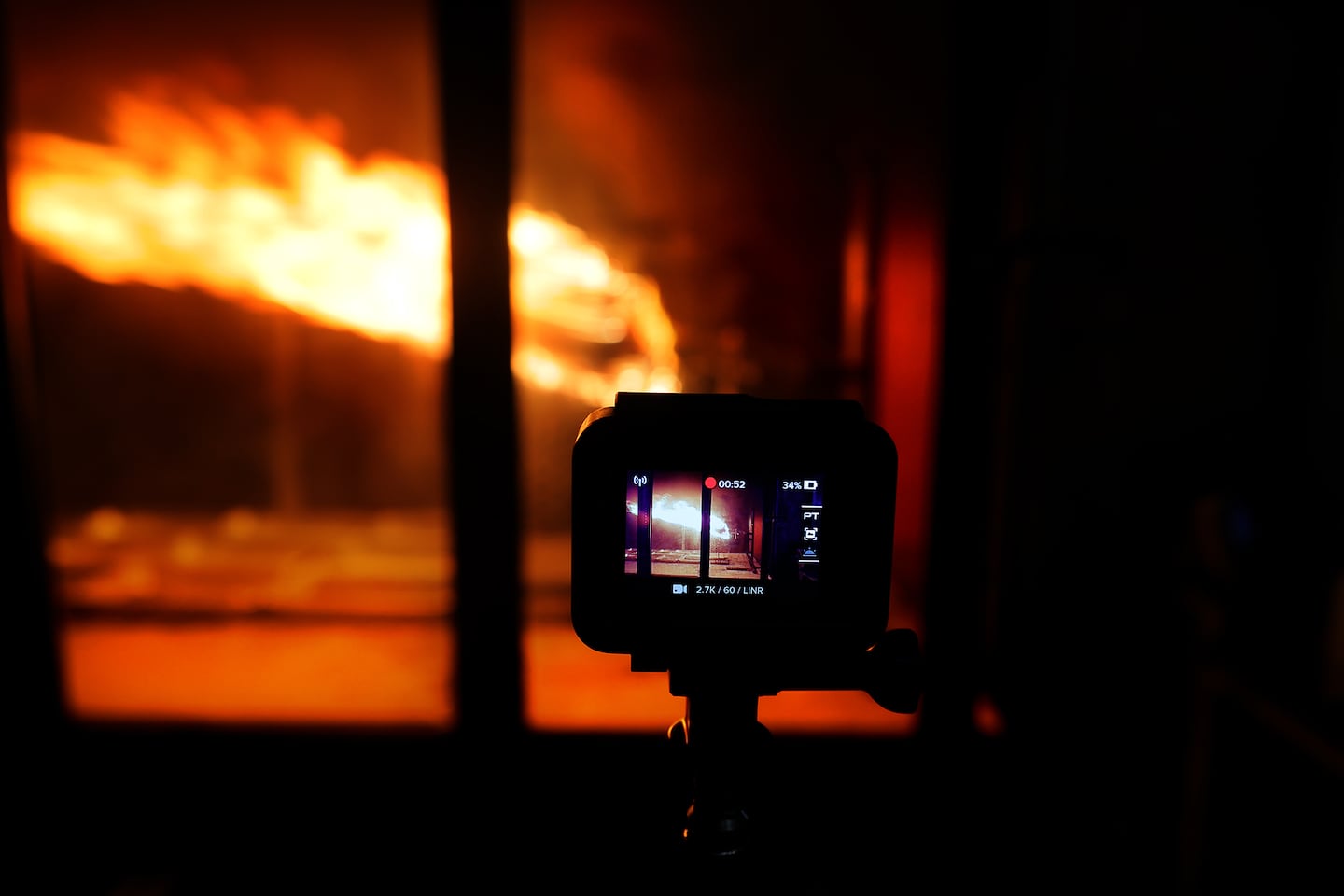 Multiple video cameras record the fires conducted inside a wind tunnel at Worcester Polytechnic Institute.