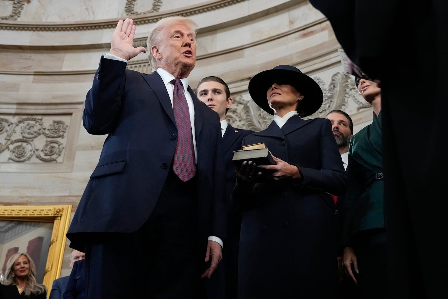 Donald Trump is sworn in as the 47th president of the United States by Chief Justice John Roberts as Melania Trump holds the Bible in the US Capitol Rotunda in Washington, DC, on Jan. 20, 2025. 