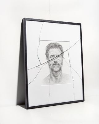 a cracked picture frame with an drawing of Alec Soth