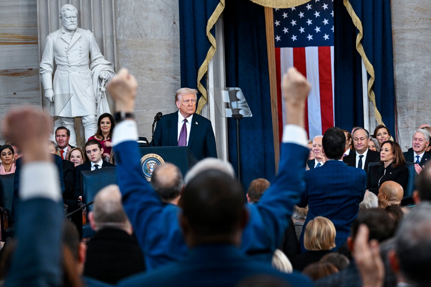 Attendees cheer as President Donald Trump speaks after taking the oath of office during the 60th Presidential Inauguration in the Rotunda of the U.S. Capitol in Washington, Monday, Jan. 20, 2025. 