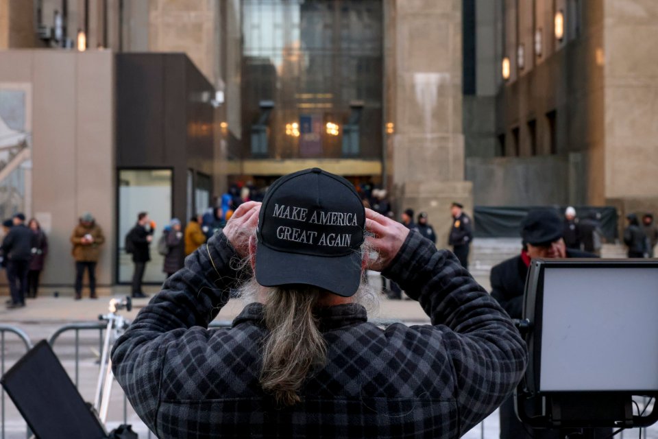 A Trump supporter wearing a black MAGA hat outside the Manhattan criminal courthouse