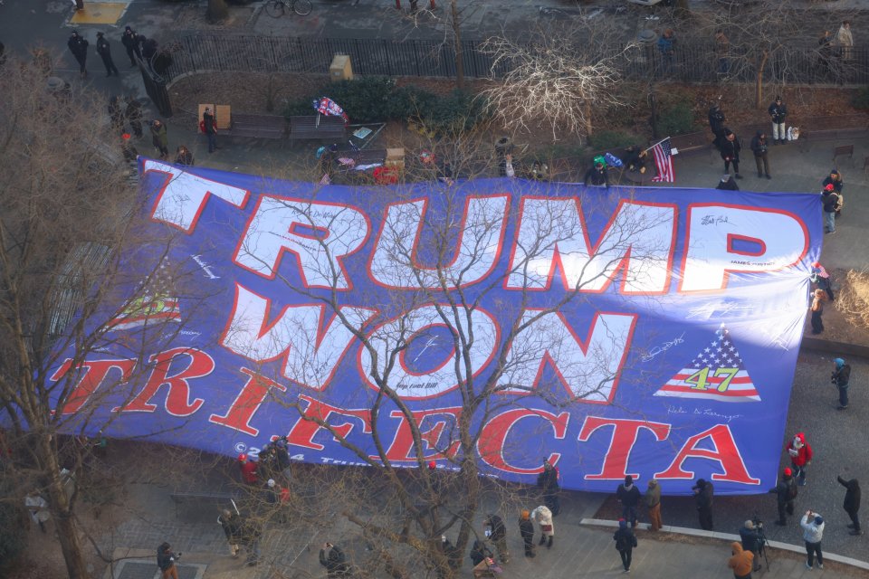 Pro-Trump supporters showcase a giant 'Trump Won Trifecta' banner