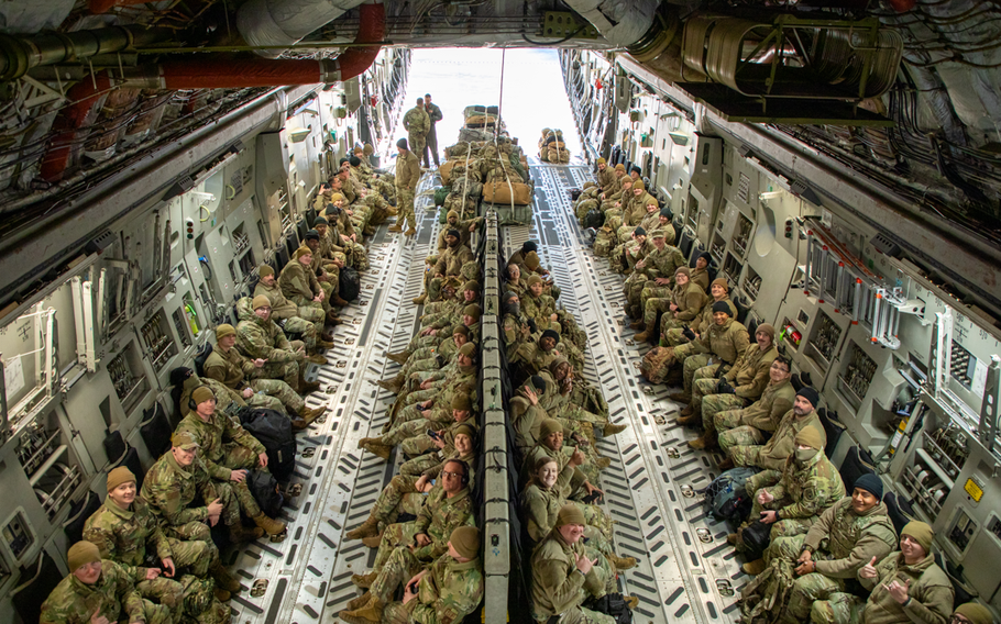 Soldiers and airmen with the Tennessee National Guard depart in a C-17 Globemaster III