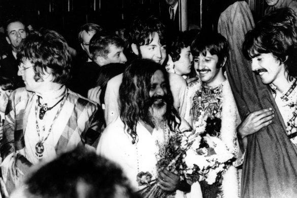 The Beatles join the Maharishi Mahesh Yogi (centre) as they arrive in Bangor, Wales, for a weekend of meditation in August 1967.