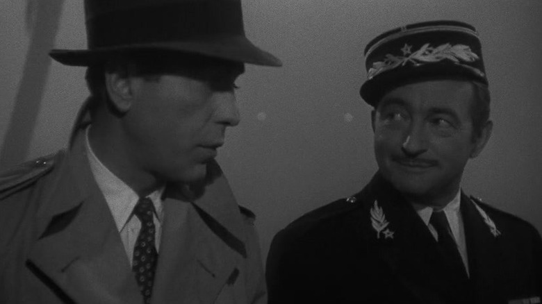 Humphrey Bogart and Claude Rains as Rick Blaine and Louis Renault, talking in Casablanca