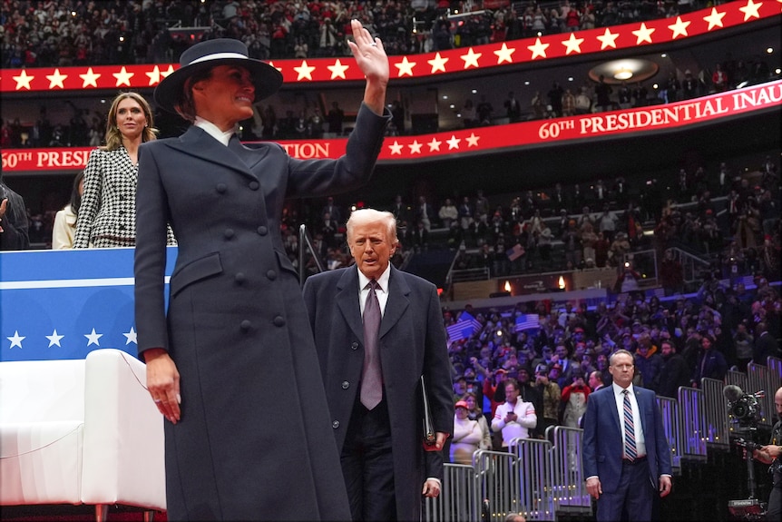  Donald Trump and first lady Melania Trump arrive at an indoor Presidential Inauguration.