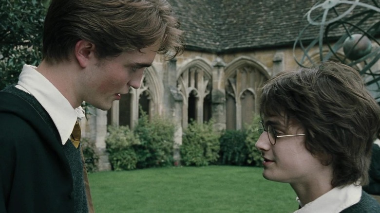 Robert Pattinson as Cedric Diggory talks to Daniel Radcliffe as Harry Potter 