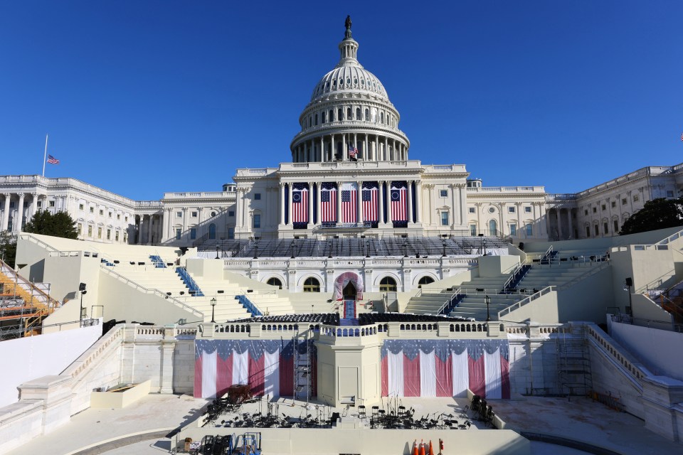 The US Capitol building with a temporary stage set up on the west lawn.