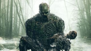 Swamp Thing holding skeleton from live-action 2019 TV series