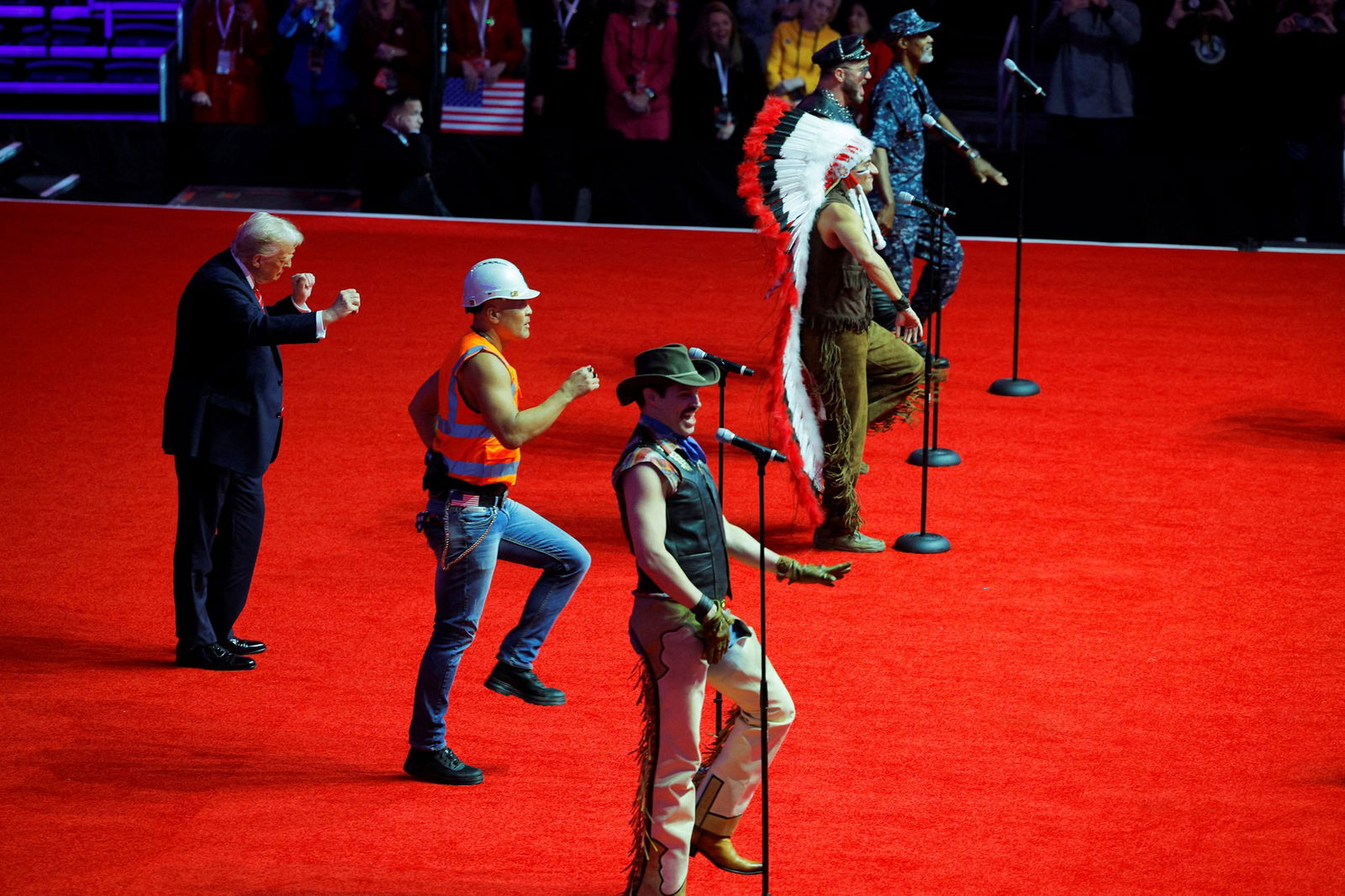 Trump dances behind The Village People 