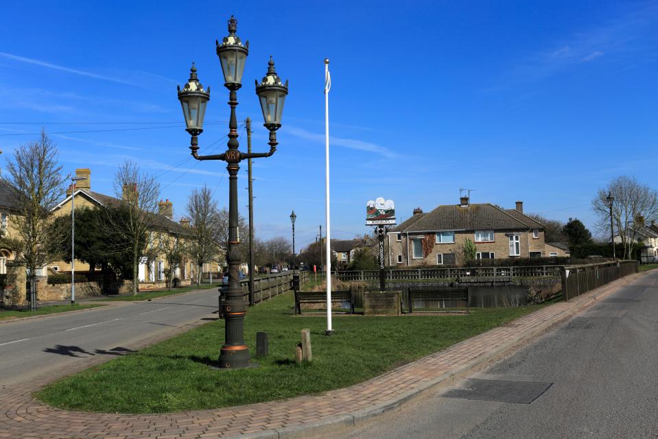 Warboys village sign and pond.