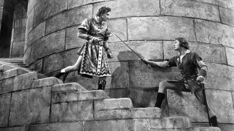 Robin Hood (Errol Flynn) has a sword fight with Guy of Clarence (Basil Rathbone) in The Adventures of Robin Hood