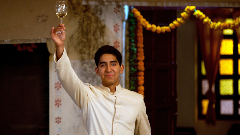 Sonny raising a glass in The Best Exotic Marigold Hotel