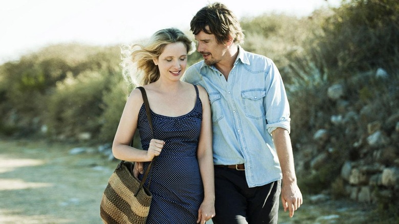 Celine and Jesse walking and smiling in Greece in Before Midnight