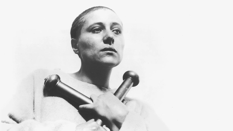 Renee Falconetti as Joan of Arc clutching cross in The Passion of Joan of Arc