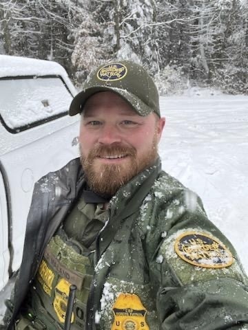 Portrait of U.S. Border Patrol agent David Maland in the snow.