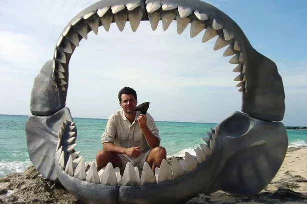 0_Steve-Leonard-and-a-model-of-a-Megalodon-tooth-and-jaw.jpg