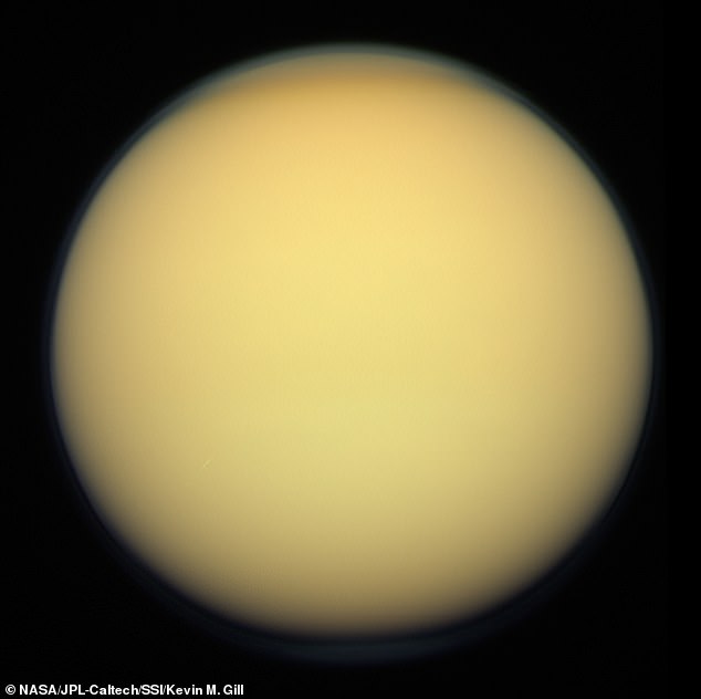 Titan, imaged by the Cassini orbiter, December 2011. A thick shroud of organic haze permanently obscures Titan's surface from viewing in visible light