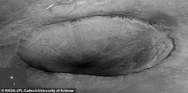 This image shows Phoenix hanging from its parachute as it descended to the Martian surface in 2008