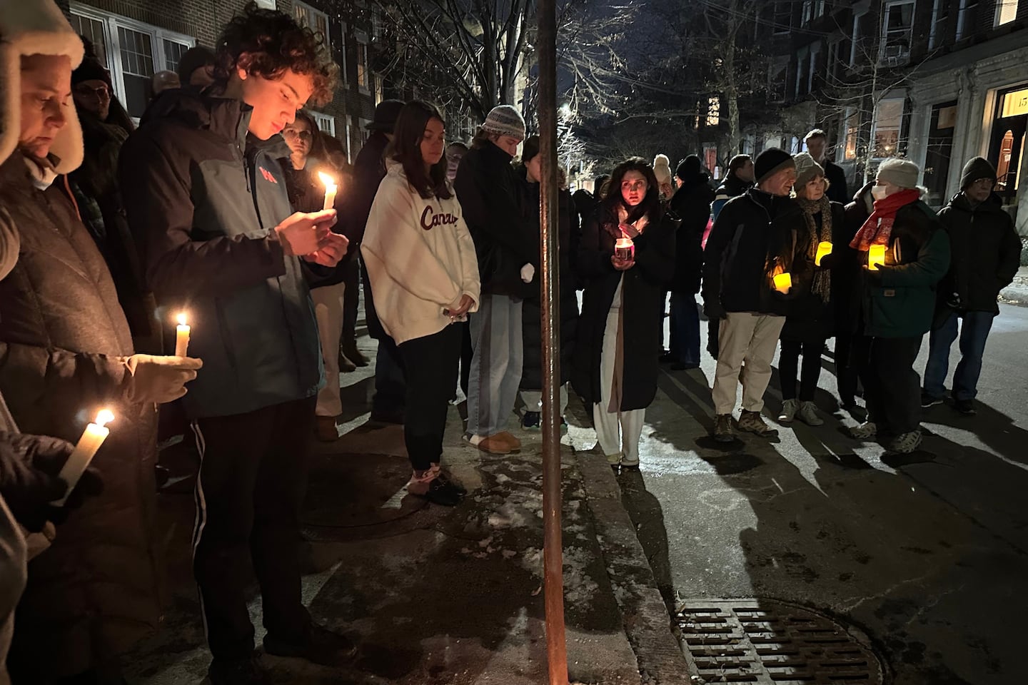 A crowd gathered Tuesday night outside the Brookline home of MIT professor Nuno F.G. Loureiro.