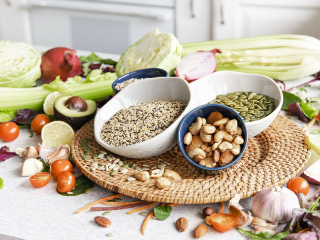 Close-up-of-a-bowl-of-chia-seeds-surrounded-by-other-healthy-superfoods-on-a-kitchen-table.jpg