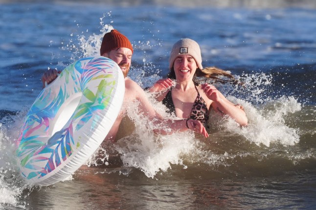 Swimmers dip in the sea at Whitley Bay in North Tyneside. Picture date: Wednesday January 1, 2025.