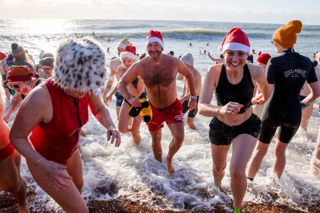 Swimmers seen during the traditional Christmas Day swim at Brighton Beach. Members of the public took part in the annual Christmas Day swim held at Brighton Beach, East Sussex. Brighton Beach Christmas Day Swim in Brighton - 25 Dec 2025