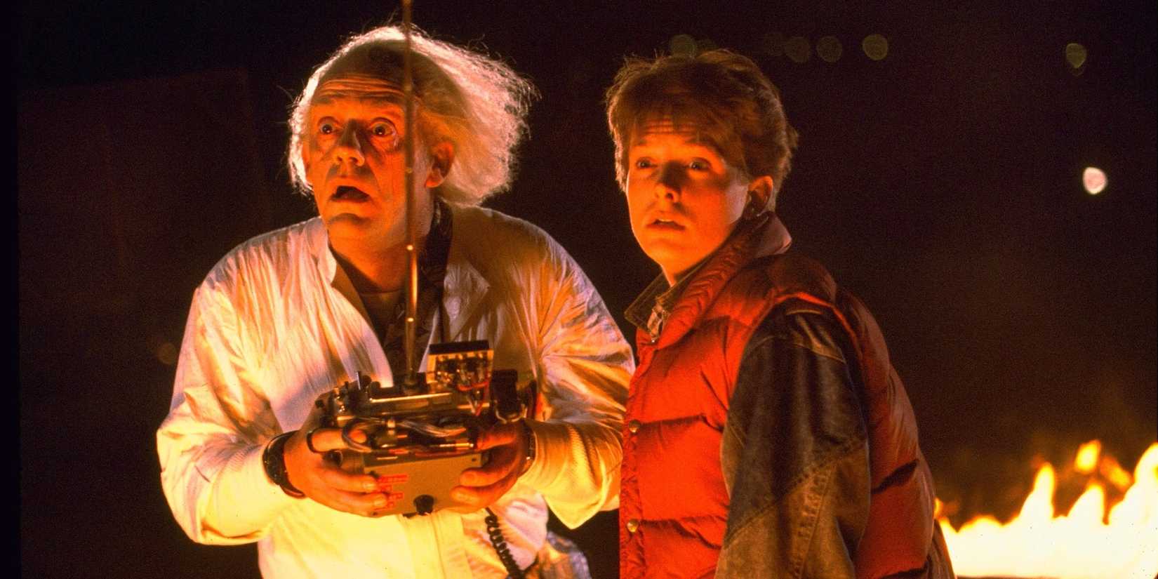 Doc and Morty look stunned and are lit by flames in Back to the Future