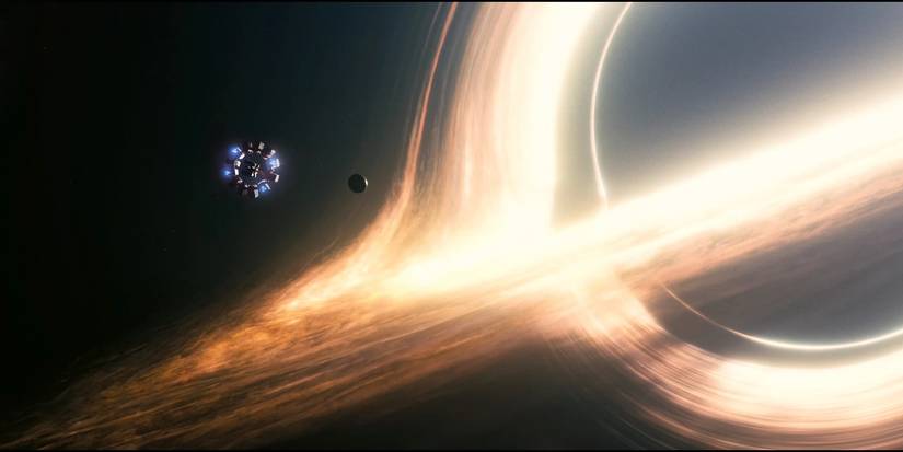 The Endurance thrusts towards a planet on the cusp of the pull of the gigantic black hole Gargantuan in 'Interstellar' (2014).