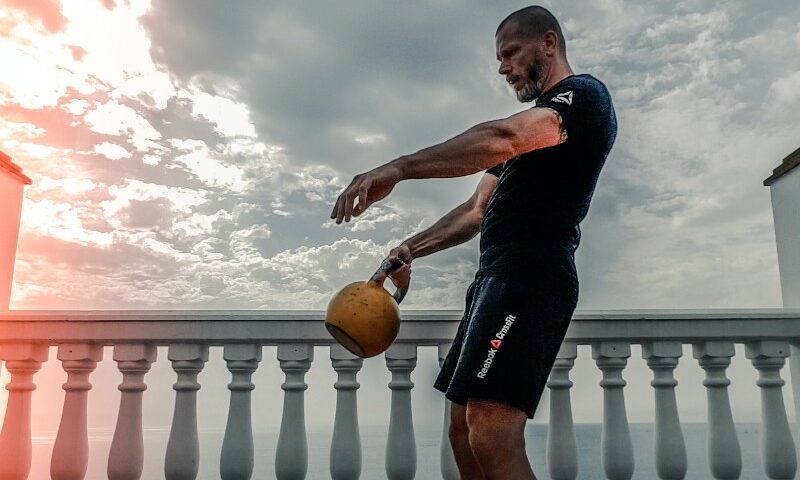 Man doing Kettlebell Swing.