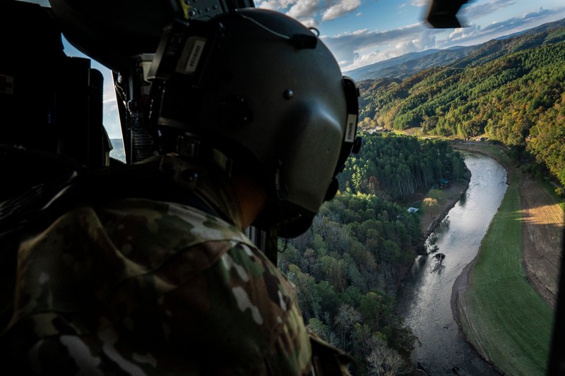 National Guard soldiers look for people in distress as they scan rural areas affected by Hurricane Helene near Ashe County, North Carolina.