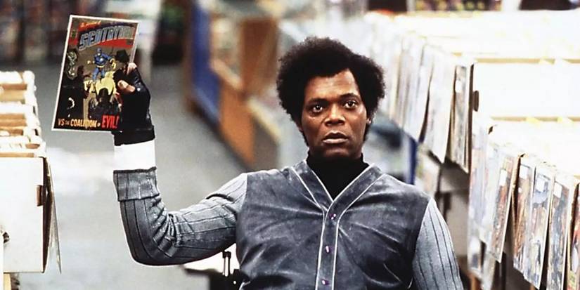 Samuel Jackson as Mr. Glass Elijah Price holding up a comic in Unbreakable