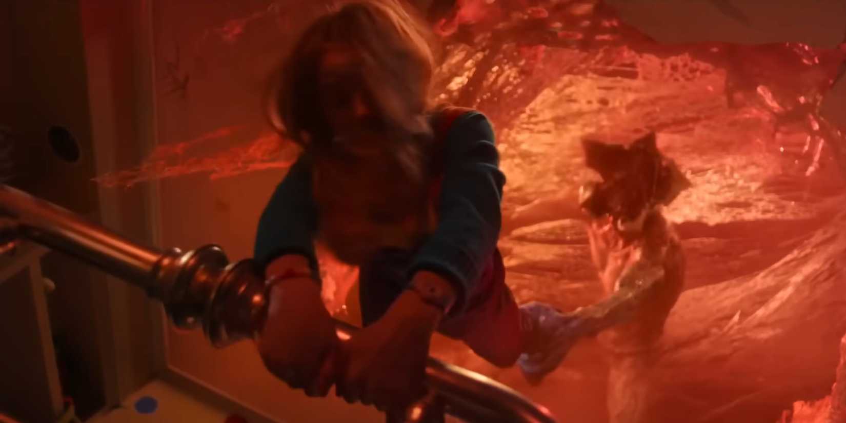 The Demogorgon grabs Holly in Stranger Things