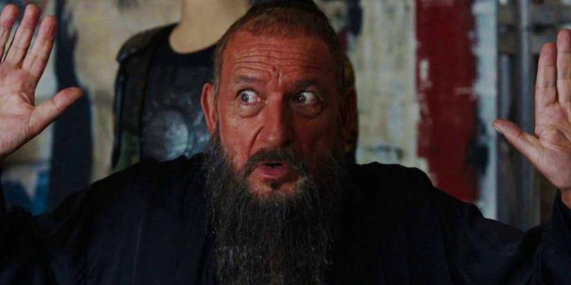 Trevor Slattery holds his hands up in Mandarin costume in Iron Man 3