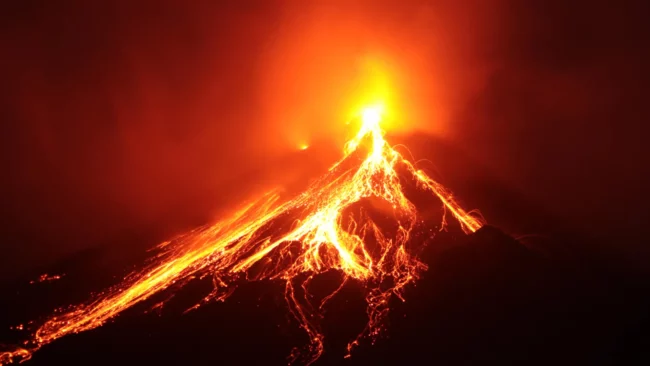 volcano-erupting-at-night-lava-flow.webp
