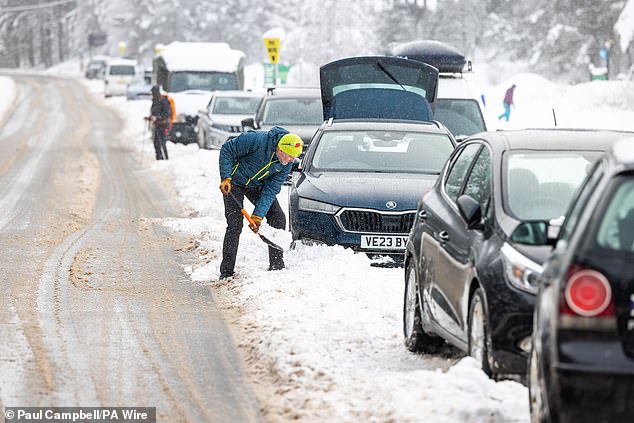 While it might feel cold now, Britain's winters are actually warmer than they might otherwise be thanks to the action of the Atlantic Meridional Overturning Circulation (AMOC). Pictured: A man clears snow from his car in Glen More, Scotland