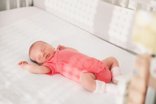 71dccf083d6c-baby-sleeping-in-cot.jpg