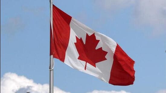 A-US-and-a-Canadian-flag-flutter-at-the-Canada-Uni_1767256078795.jpg