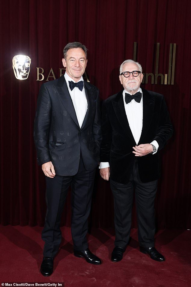 Jason Isaacs and Brian Cox both cut dapper figures for the occasion