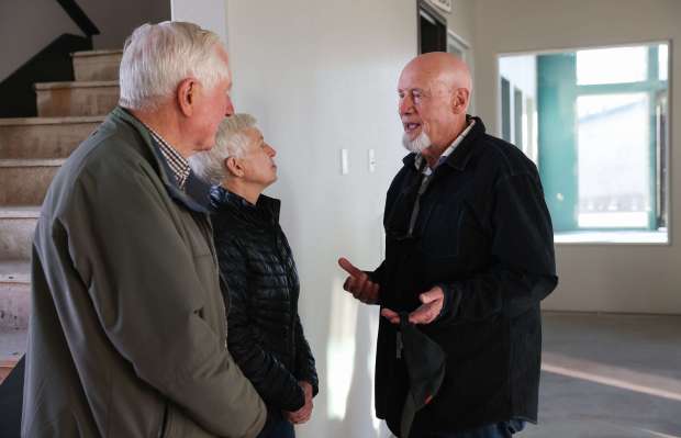 Bill Gallaher, right, talks with his wife, Cindy, and Santa...