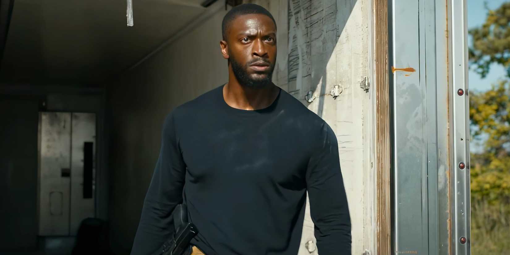 Aldis Hodge's Alex looking upset when stepping out of a moving truck in Cross season 2