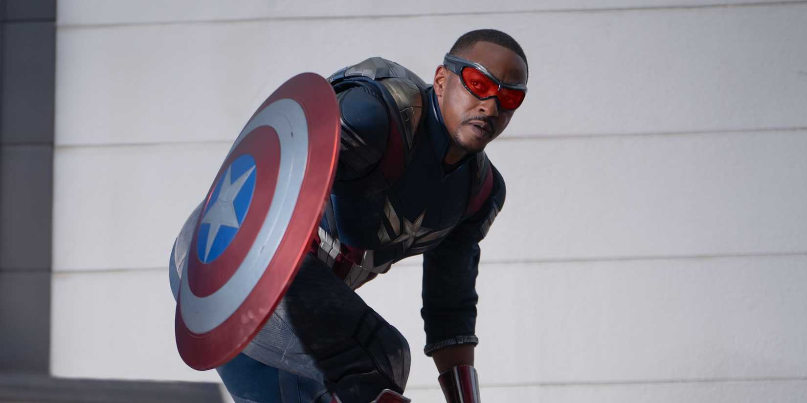 Anthony Mackie As Sam Wilson In Captain America Costume Crouching In Captain America Brave New World